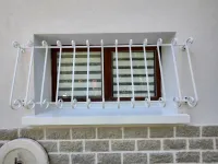 Rénovation d'une grille de défense en fer forgé (webp